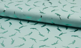 Blauwe tricot kinderstof met papegaaien in foil print Blauwe tricot kinderstof met papegaaien in foil print